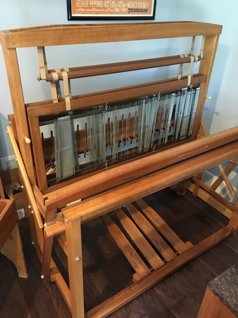 Photo of a 4-harness counterbalance loom made of cherry wood.